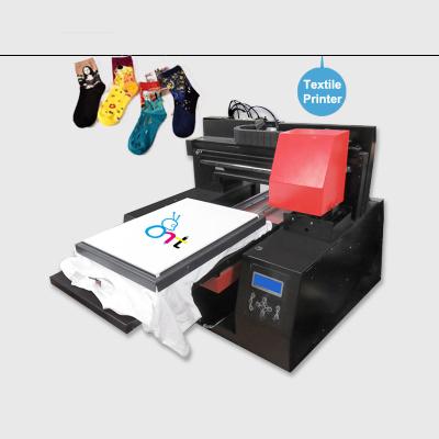 China 6090 dtg size t-shirt garment printer china a3 uv printer dtg printer for hotels antprint t-shirt printing machine best for sale