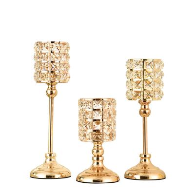 China Home decoration luxury antique cylinder table Nordic wedding glass decoration molds gold metal candle holder crystal glass candlestick candle holders for sale