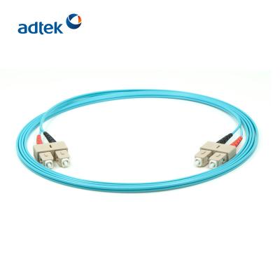 China OM3 Fiber Optic Patch Cord SC To SC UPC LSZH/PVC DX Multimode Duplex J3U3U2233P-AQ for sale