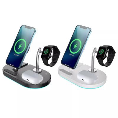 China Magnetic 15W Earphone 4 in 1 Wireless Fast Charger Mobile Phone 12V/2A 9V/3A Charging Low Desk Stand for sale