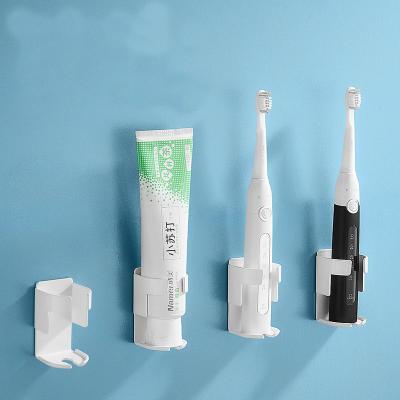 China Durable Wall Mounted Adhesive Electric Toothbrush Holder Plastic Bathroom Organizer Accessory for sale