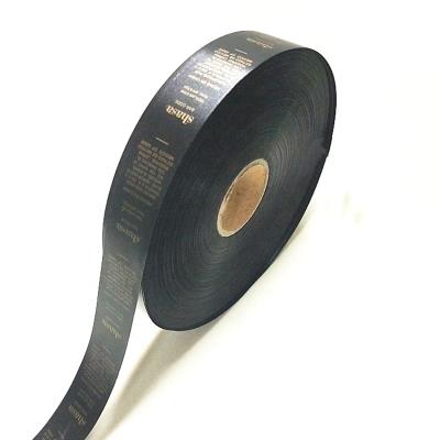 China Screen Printing Custom Printed Polyester Label Roll Satin Fabric Ribbon Care Woven Label Black Wash Tape for sale