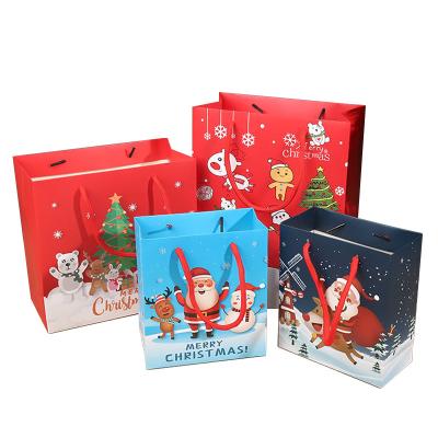 China Durable Christmas Paper Gift Bags Offset Printing Cardboard Packaging Bags for sale