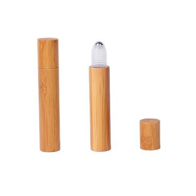 China 2022 Personal Care New Product 10ml Clear Oil Glass Roll On Bottle With Bamboo Wooden Trackball Top Cap for sale