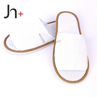 China Hotel Airline Spa Promotional Cheap Price Waffle Cloth Style Hotel Home Moving Disposable Slipper For Hotel for sale