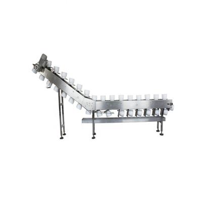 China Inclined Type Food Safety Grade Bowl Conveyor For Packing Production Line for sale