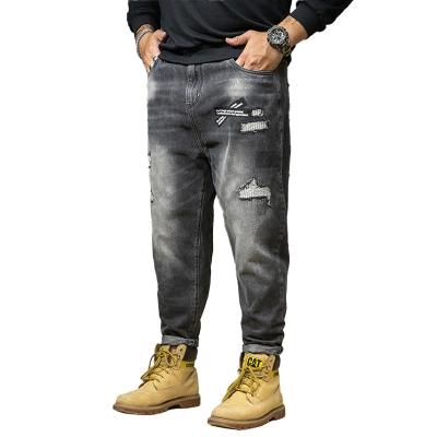 China Breathable Autumn/Winter New Plus Size Mens Jeans Loose Stretch Ripped Holes Mens Jeans Pants for sale