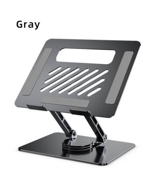 China 2023 adjustable hot sale fashion good quality aluminum oxidation swivel slash hollowed out phones tablets and laptops stand for iphone for sale