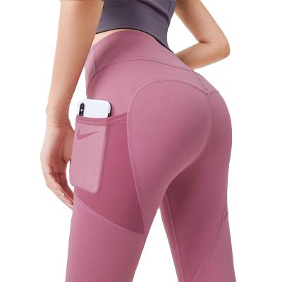 China High quality hip-lifting high-waisted women's breathable yoga leggings with side pockets for sale