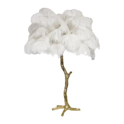 China Modern Hot Sale Gold Decoration Light Natural Ostrich Feathered Copper Bronze Palm Table Lamp With Bulbs for sale