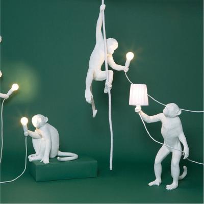 China Industrial Nordic Modern Creative Animal Pendant Light Rope Resin Ceiling Wall Hanging Decor Monkey Lamps LED Lights Monkey Table Lamp for sale