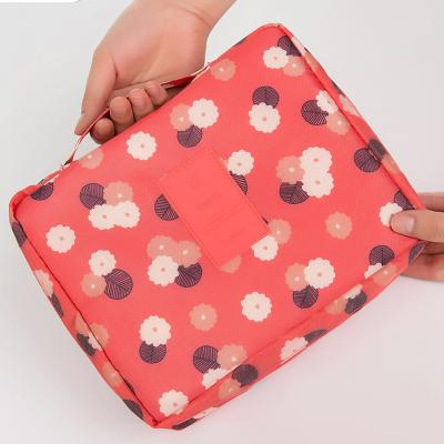 China Fashion Flowers Star Pattern Waterproof Printing Oxford Cloth Hand Wash Bag Travel Cosmetic Bag for sale