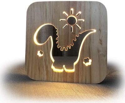 China Modern Dinosaur Shape Carved Hollow Wooden 3D Night Lamp For Kids Nursery Night Light Bedside Bed Home Decor for sale