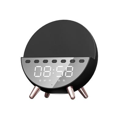 China Amazon Mobile Phone 2022 New Bass Stereo Multifunctional BT 5.0 LED Digital 4 in 1 Alarm Clock Wireless Charger Speaker with FM Radio for sale