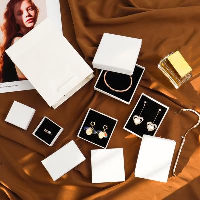 China Simple Line Ring Jewelry Box Set Necklace Bracelet Earring Paper White Box Stud Ear Box for sale