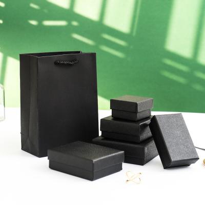 China Wholesale Black Floating Ring Jewelry Box Earrings Necklace Box Set Bracelet Gift Box Paper Plaid for sale