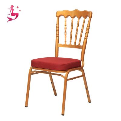 China Wholesale stackable metal gold banquet wedding ceremony used stackable chiavari chairs with red fabric cushion for sale