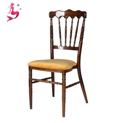 China Napoleon style gold iron stackable modern banquet wedding royal chiavari stacking chairs with cushion for sale