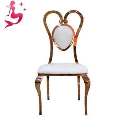 China Modern royal luxury heart shape hotel dinner seating mounted gold stainless steel banquet dining chair for wedding and restaurant for sale