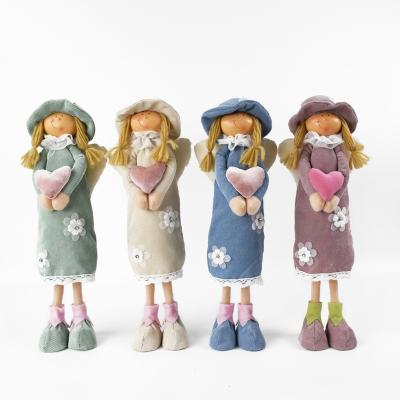 China Handcraft 2022 Wholesale New Design Spring Gift Cute Handmade Fairy Dolls Cloth Standing Doll Holding A Heart For Home Decoration for sale