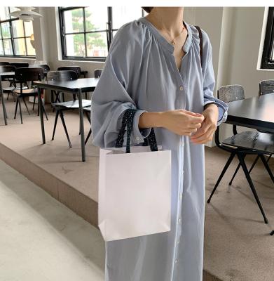 China DE053 Breathable Solid Midi Dress 2021 New Minimalist Women's O-Neck Lantern Sleeve Button Down Long Loose Mid-Calf Fit Casual Dresses for sale