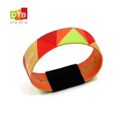 China New Arrival Waterproof Polyester Elastic NFC RFID NTAG Adjustable Custom Printable Cloth Woven Wristband/Waterproof For Theme Park for sale