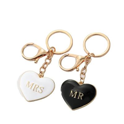 China Metal Personality Alloy Peach Black And White Heart Drip Oil Letter MrMrs Love Bag Key Pendant Chain for sale