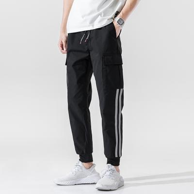 China Anti-wrinkle detail sports logo polyester sports tracksuit for men with side pockets for sale