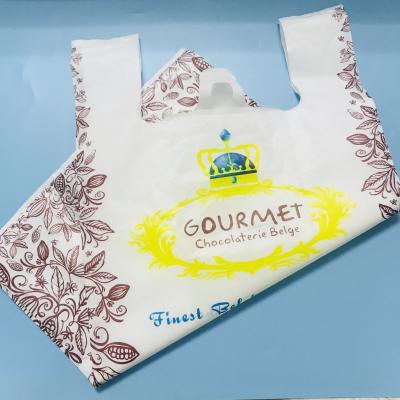 China Custom Design Plastic Bag With Handle printed white packing plastic bag for clothing shopping bags for sale