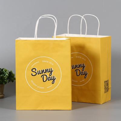 China Popular quality wholesale customized creative logo color kraft paper gifts shopping paper bags for sale