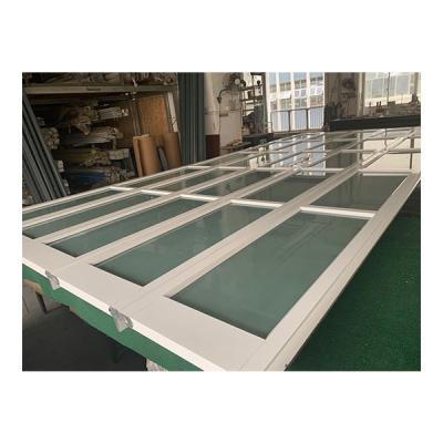 China Heat Insulation Garage White Aluminum Glass Sectional Door for sale