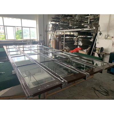 China Automatic Overhead Clear Glass Heat Insulation Panel Garage Door for sale