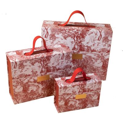 China Recycled Materials Luxury Ad Foldable Paper Box Unique Packaging Boxes With Handle Clothing Apparel Gift Box for sale