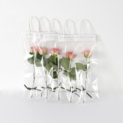 China Recyclable Clear Waterproof Plastic Flower Carry Paper Bag For Mothers Day Valentines Day Handbag Flower Packaging Bag for sale