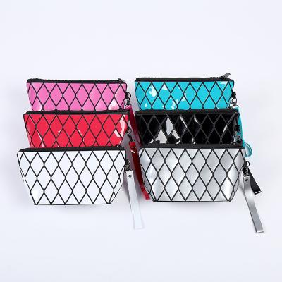 China Waterproof Recycled Cosmetic Geometric Toiletry Bag Wristlet PVC Pouch Travel Makeup Bag Cosmetic Travel Material for sale