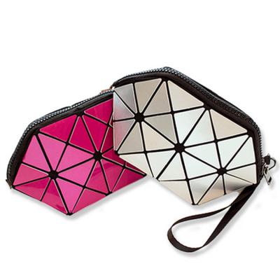 China Cheap Customized Colorful Geometric Logo Women PVC Clutch Waterproof Pouch Makeup Cosmetic Bag for sale