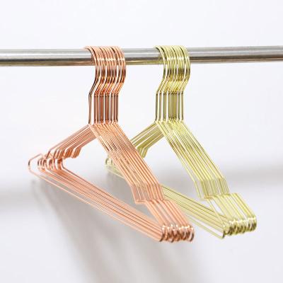 China Minimalist PVD Plated Modern Luxury Clothing Store And Home Durable Metal Hanger for sale