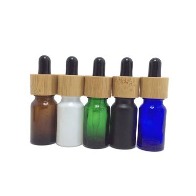 China Premium Quality Roller Bottles 10ml 30ml White Bamboo Essential Oil Glass Bottles for sale