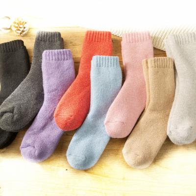 China Yili Breathable 50% Wool Red Women And Men's Fleece Lined Tube Extra Thick Wool Socks Winter Fuzzy Socks for sale