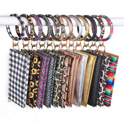 China Fashion PU Bracelet Key Chain Wallet Sunflower Leather Leopard Printed Bracelet Key Ring Holder Wristlet Keychain Handbag Phone Bag for sale