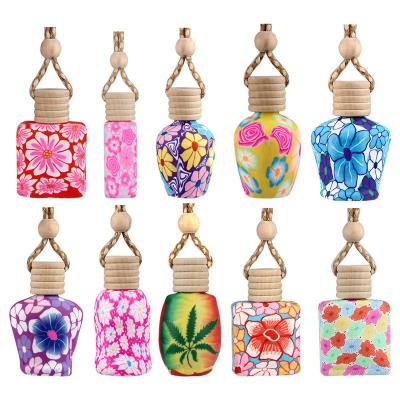 China Modern Car Air Freshener Perfume Decoration Clay Car Perfume Bottle Pendant Empty Polymer Glass Bottles Ornament for sale