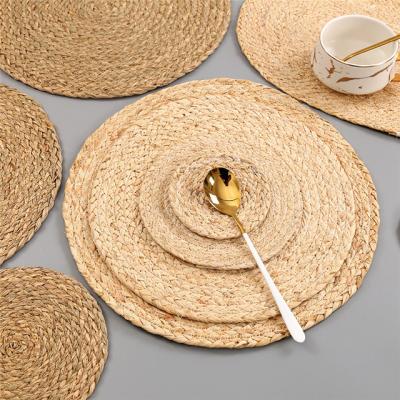 China Sustainable Handmade Natural Material Woven Round Place Mat Coaster Kitchen Accessories for sale