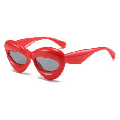 China Fashion Sunglasses Candy Color Frame Plastic Sexy Thick Lip Shape Fashion Cat Eye Sunglasses Hip Hop for sale