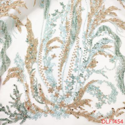 China Stone Beaded Women's Clothing Sequins Embroidery Fabric Tulle Heavy Beaded Lace Embroidery Lace Fabric for sale