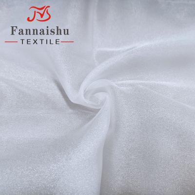 China 2020 wholesale 100% polyester anti-static new arrival shiny cloud snow organza fabric for wedding dress for sale