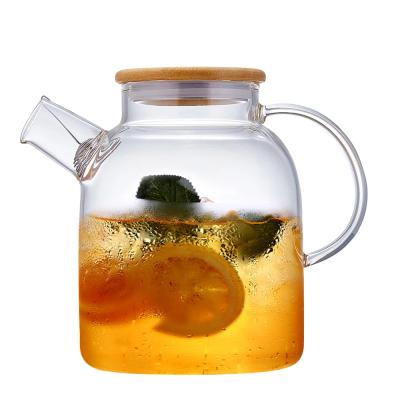 China Sustainable Flower 1.5L Heat Resistant Glass Teapot With Bamboo Lid for sale