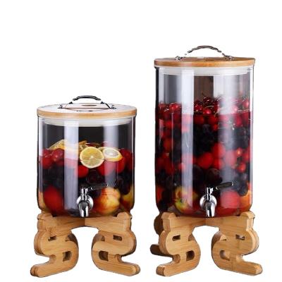 China Food Safety High Borosilicate Glass Bamboo Lid Drinking Drink Dispenser for sale