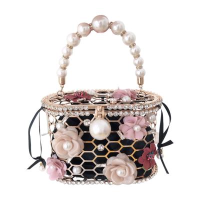 China New fashion women's handbag women's luxury bucket bag flowers metal handbags temperament goddess metal pearl bag for sale