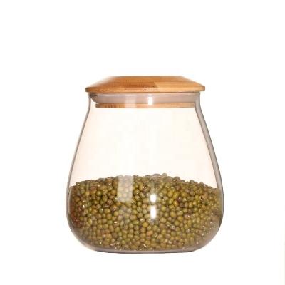 China Hand Blown Clear Cereal Sugar Tea Borosilicate Glass Jar Eco-Friendly Sustainable With Airtight Bamboo Lid for sale