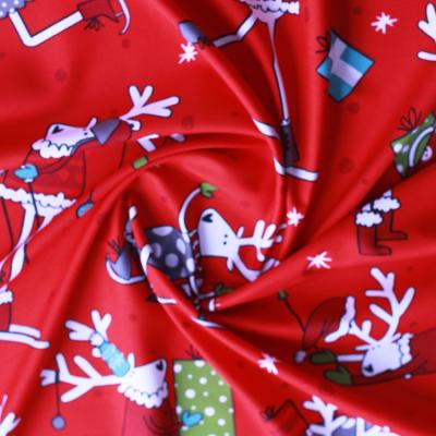 China Cheap Hot Sale Shrink-Resistant Red Christmas Cloth Polyester Cartoons Animal Printing Fabric for sale